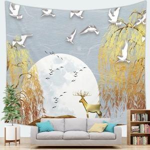 Detail of artistic landscape tapestry featuring golden deer and birds over a sofa