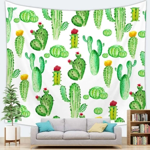 Detail of Nordic cactus watercolor tapestry hanging as backdrop above a living room sofa