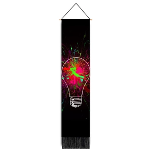 Detailed view of black art tapestry with colorful neon light bulb design and fringe