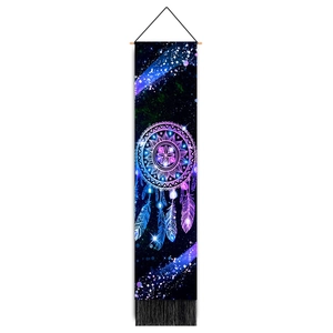 Detail of colorful dreamcatcher tapestry with mandala patterns and black tassels