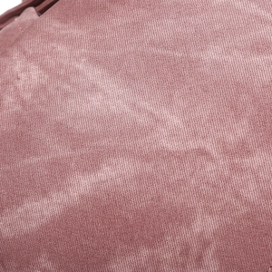 Macro shot of pink PU leather texture with smooth finish and detailed grain for backpacks