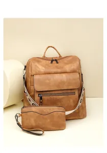 Detail view of khaki faux leather backpack set with ethnic embroidery wide strap