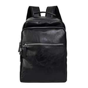 Vintage black leather backpack with multiple pockets and silver zippers for business commute