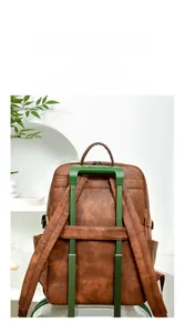 Deep brown leather backpack featuring a luggage strap for convenient business travel use