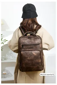Rear view of business PU backpack in dark brown on model showing its normal capacity effect