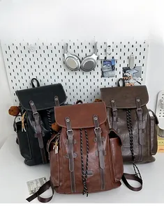 Three retro style PU leather backpacks in black and brown colors with drawstring closure