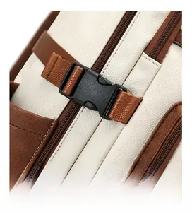 Detail of adjustable side buckle and premium textured beige leather on business backpack