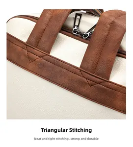 Detail of triangular reinforced stitching and dual metal zippers on leather laptop backpack