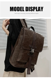 Brown vintage faux leather backpack shown worn by a model against a white window background