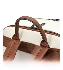 Detail view of contrast color backpack with pebbled PU leather and dual metal zippers