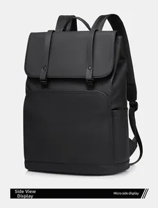 Sleek matte black business backpack showing a micro side view of the waterproof material