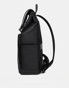 Side view of a matte black waterproof backpack with breathable mesh back and sleek design