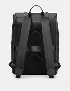 Rear view of business backpack featuring breathable mesh back panel and luggage strap