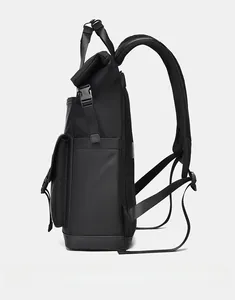 Side view of black waterproof roll-top backpack with adjustable buckles and mesh pockets