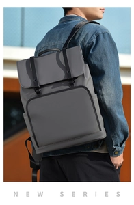 Close-up of gray minimalist commuter backpack featuring waterproof matte fabric and buckles