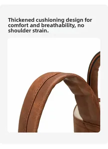 Close-up of padded brown PU leather shoulder strap with reinforced stitching and soft cushion