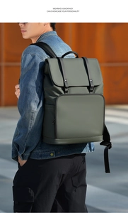 Waterproof sage green backpack with buckle details worn by a man in a city setting