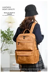 Sac à dos marron vintage pour homme avec sangle de bagage et design multi-poches