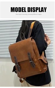 Detail of vintage PU leather backpack with contrast stitching and silver buckle straps