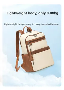 Detail of minimalist beige backpack with tassels and two zip pockets, weighing 0.88kg