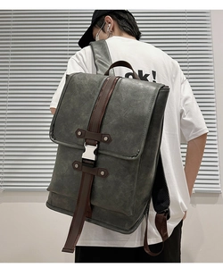 Detail of a large capacity retro faux leather backpack with metallic buckle closure