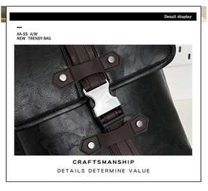Detail view of leather texture and silver metal buckle on the black travel backpack