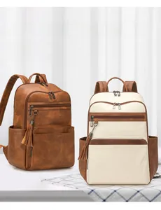Close-up of minimalist women's backpack with retro textured PU leather and tassel zipper detail