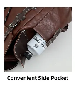 Close-up of the vintage brown leather backpack showing a functional side storage pocket
