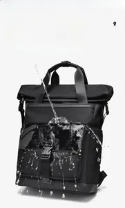 Waterproof business backpack showing high-density fabric resistance with water splashes