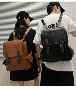 Detailed view of vintage PU leather backpack with double buckles and side pockets