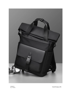 Detail of waterproof matte fabric and buckle closure on black business backpack