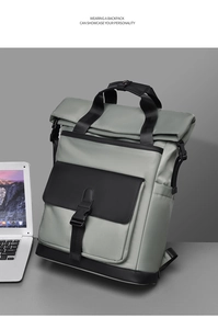 Detail of grey waterproof nylon backpack with roll-top design and front buckle pocket