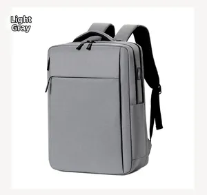 Detail view of light gray business laptop backpack featuring side USB charging port