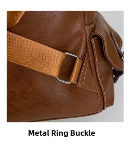 Detail of silver hardware buckle and stitching on vintage brown leather backpack