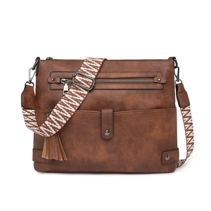 Vintage brown leather crossbody bag with ethnic patterned strap and fringe detail