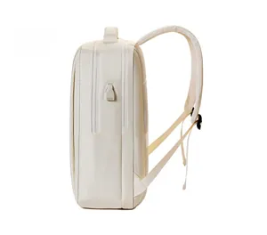 Side view of beige business laptop backpack featuring USB charging port and mesh straps