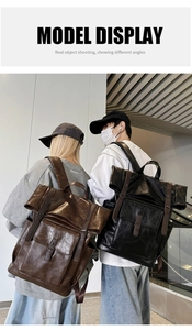 Model displaying black and coffee vintage PU leather backpacks with roll-top design
