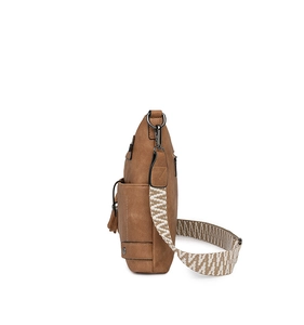 Brown vintage shoulder bag detail with fringed side pocket and woven geometric strap