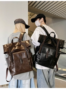 Detailed back view of vintage large capacity PU leather backpacks in brown and black