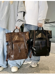 Classic vintage PU leather backpacks in brown and black with roll-top and buckles
