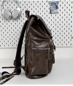 Side view of dark brown PU leather backpack with vintage texture and metal zipper