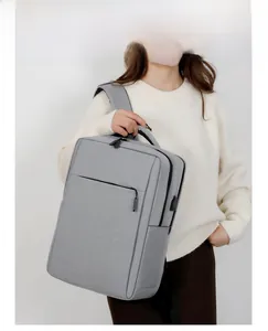 Detail of grey business laptop backpack featuring an external USB charging port for commuters