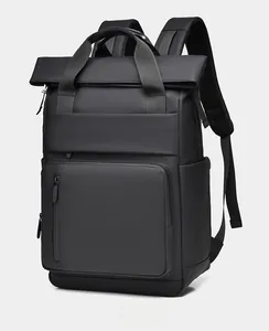 Detail view of black business backpack showing side pocket and matte waterproof material