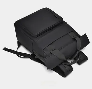 Top view of black business backpack showing durable handle and padded shoulder straps