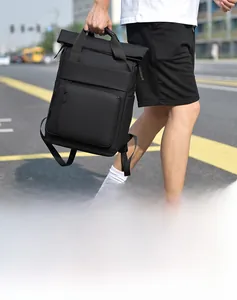 City street shot of a matte black waterproof business backpack for travel and commuting