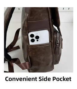 Detail view of the side pocket on a dark brown vintage PU backpack holding a smartphone