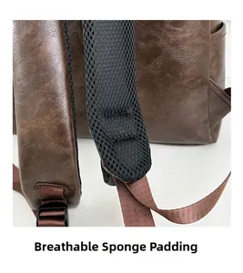Detail view of brown PU leather backpack with breathable mesh padded shoulder straps