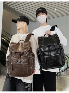 Men retro leather backpacks in black and brown finish shown on models for size scale