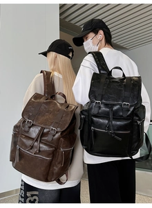 Rear view of models wearing large capacity vintage PU leather backpacks in black and brown