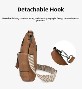 Detail view of the brown leather bag showing detachable woven strap and metal swivel hook